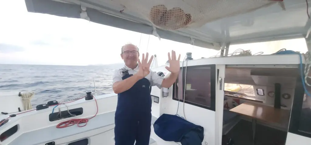 Michel showing his fingers, very happy. Merlin covered 1,691 nautical miles from Marina Mindelo to Horta Marina in nine days and one hour