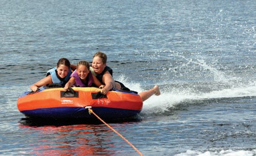 family family being pulled in a dingy