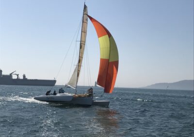 Farrier F9R Twister for sale, sailing under spinnaker