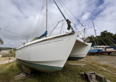 Twins 36 'Incognita' on the hard for sale at the Multihull Centre